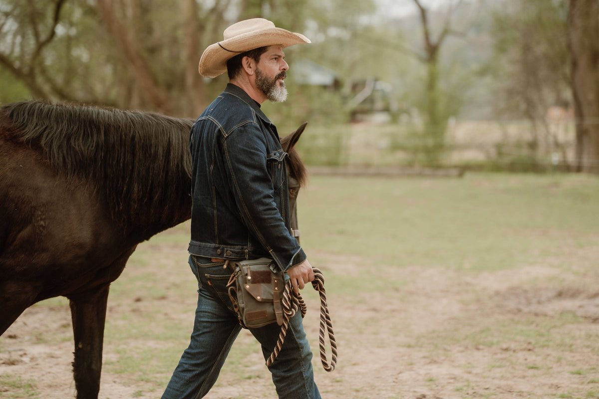 Brookshire in Chocolate worn on the hip while leading a horse#color_chocolate