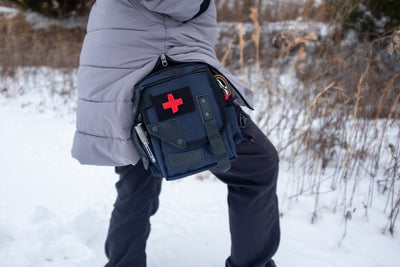 Saddleback in Navy worn on the hip in snow